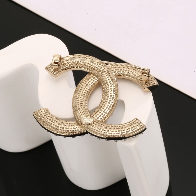 Ch**el brooches